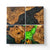 Maple burl coasters with a swirling green resin with a white background.