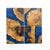 Oak burl coasters with pacific blue resin with a white background.