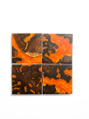 Walnut Burl with orange resin with a white background.