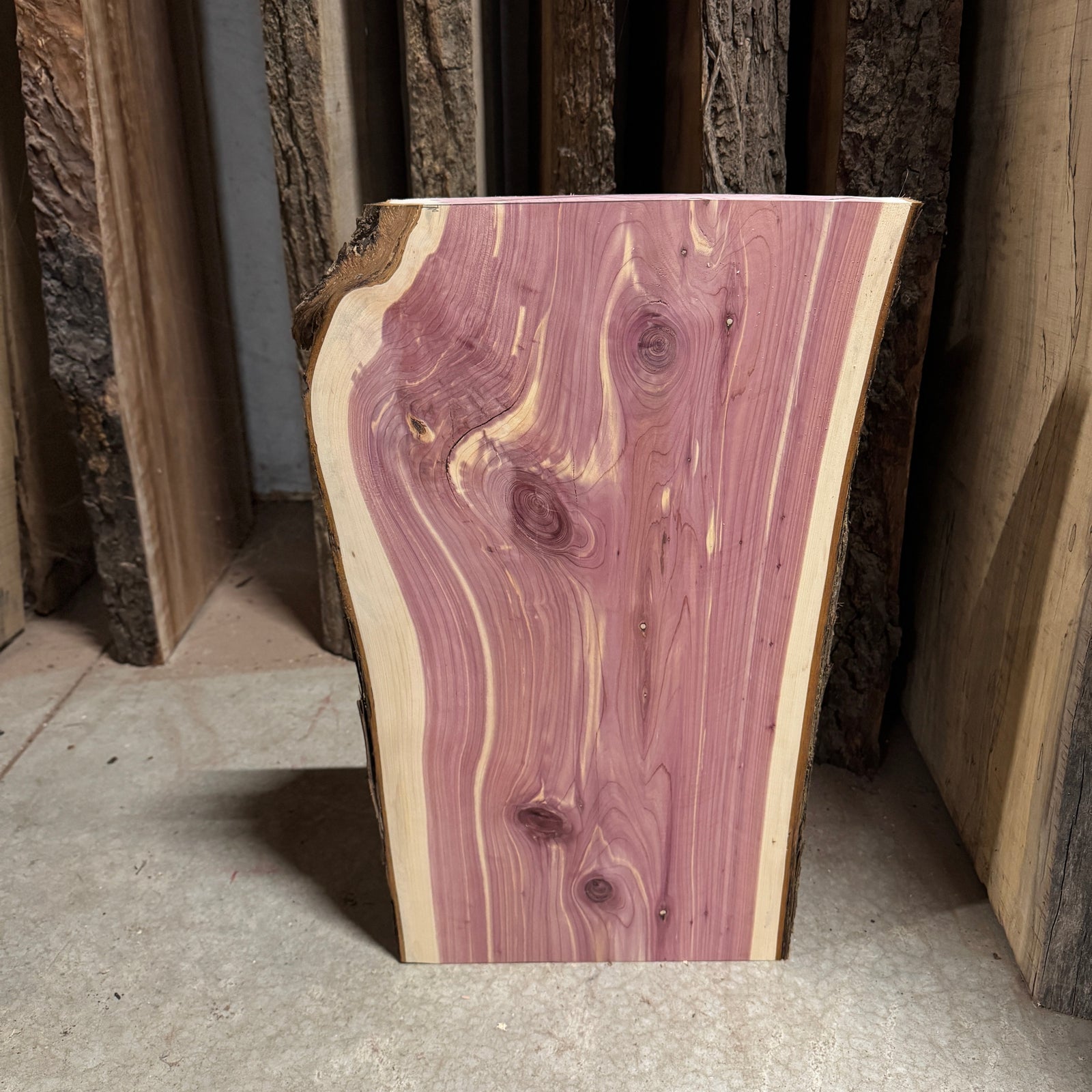 Aromatic Cedar Slab, a pinkish-purple slab with white streaks.