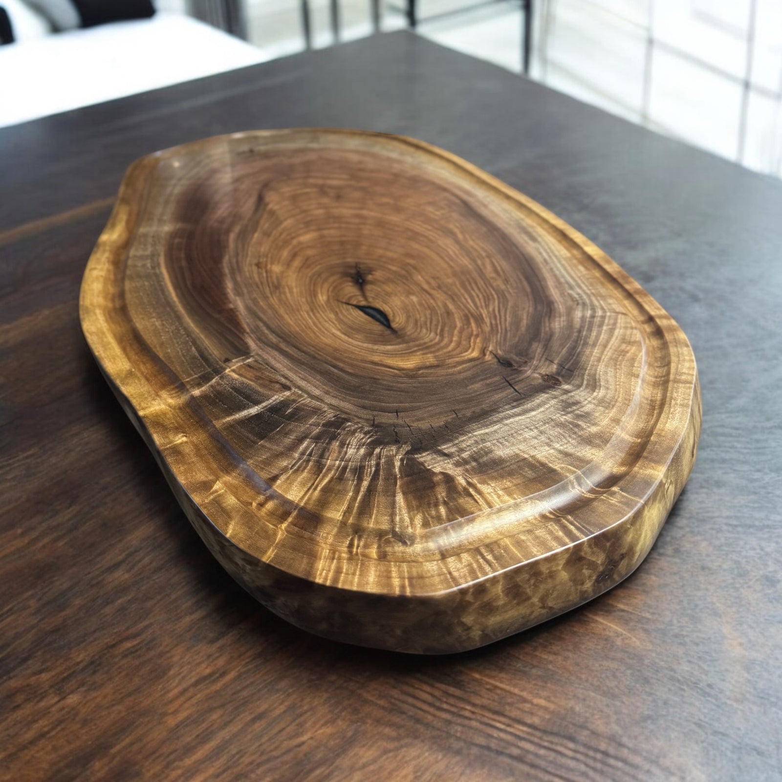 Large Live Edge Walnut Cutting Board with a juice groove that follows the natural live edge.