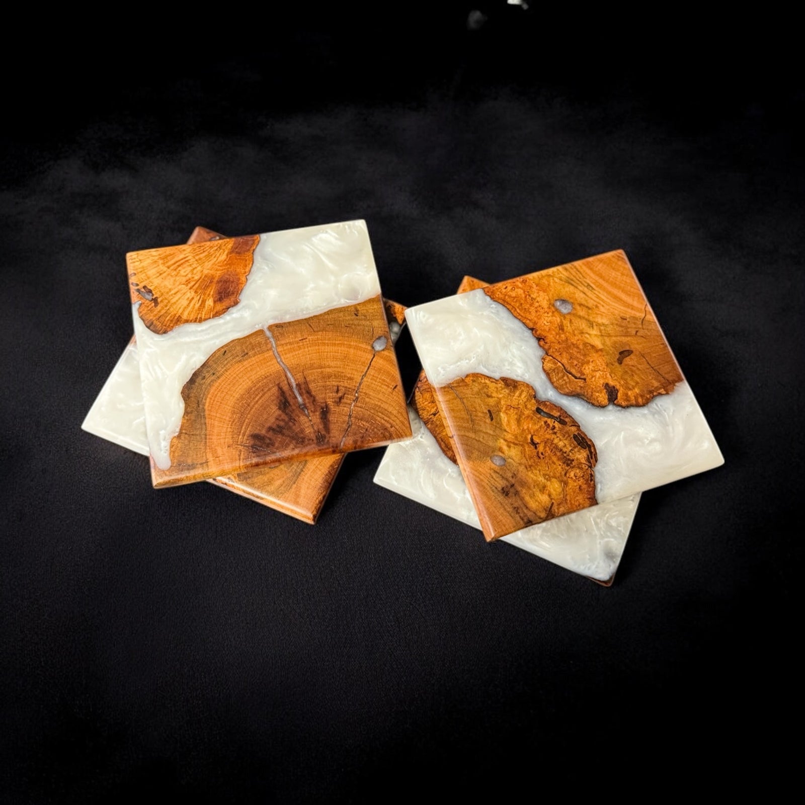 Cherry Burl Coasters with Pearl Resin with a black smoky background