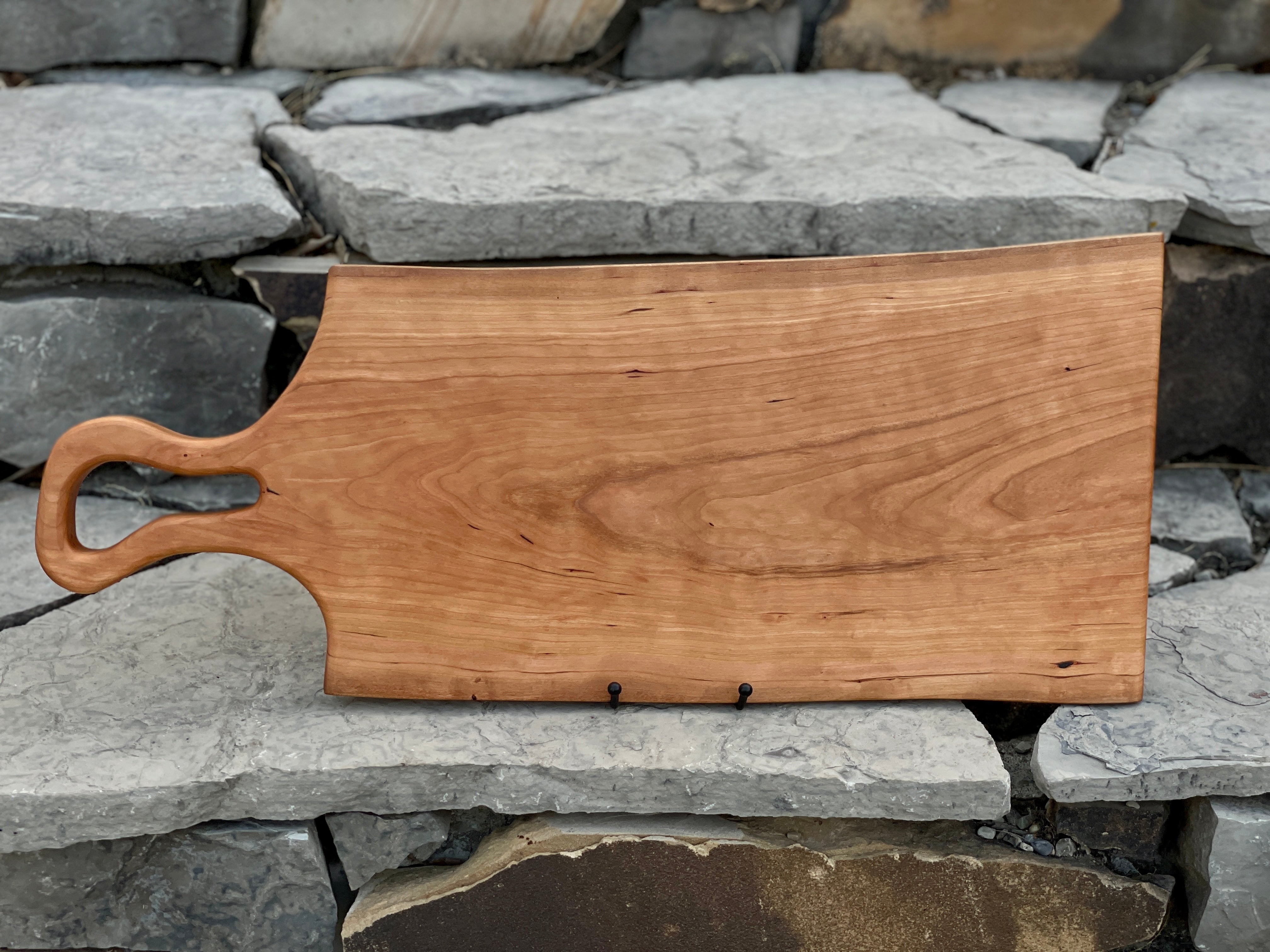 Natural hand crafted solid cherry live edge wood cutting board